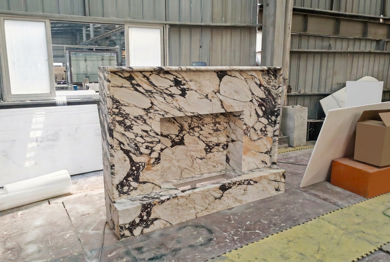 Monumental Calacatta Viola marble fireplace surround with dramatic purple and ochre veining, photographed in the workshop