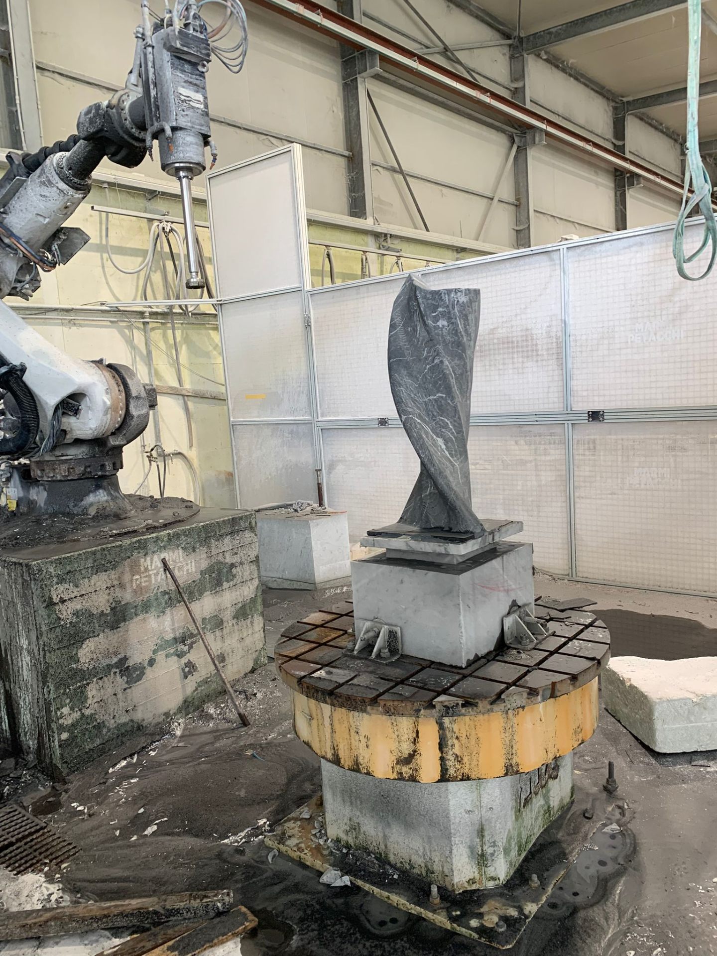 Twisted grey marble sculpture on the 5-axis CNC table